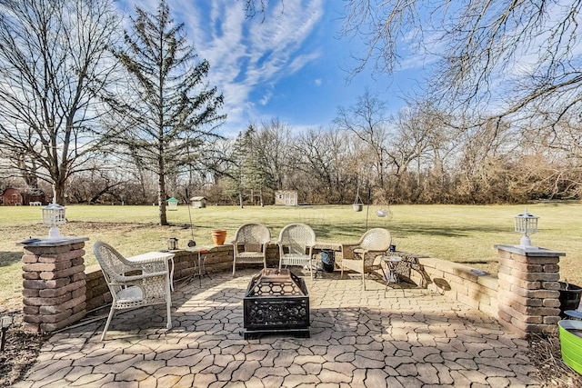 view of patio / terrace featuring a fire pit