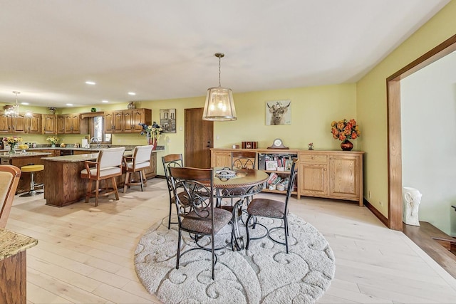 dining space with light hardwood / wood-style flooring