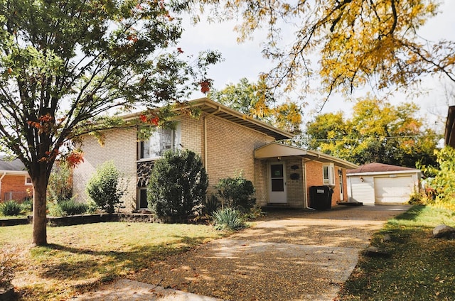 view of front of property with a garage and an outdoor structure