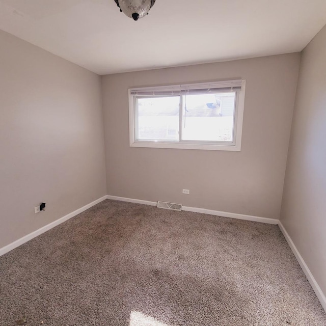 view of carpeted spare room