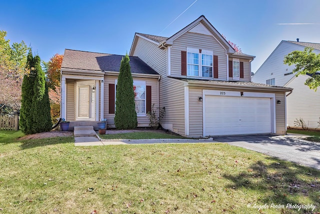 front of property featuring a front yard and a garage