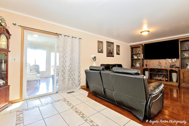 tiled living room with crown molding