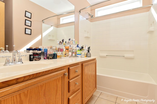 bathroom featuring shower / tub combination, vanity, tile patterned floors, and a wealth of natural light