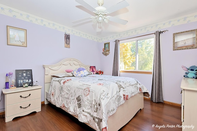 bedroom featuring ceiling fan and dark hardwood / wood-style floors