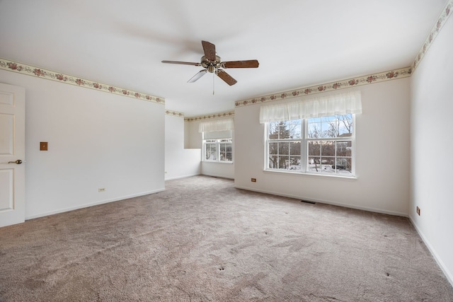 empty room with carpet floors and ceiling fan