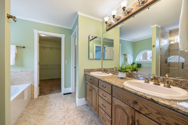 bathroom with vanity, independent shower and bath, and crown molding