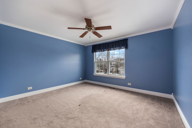 unfurnished room with carpet flooring, crown molding, and ceiling fan