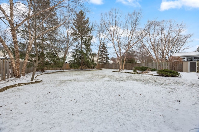 view of yard layered in snow