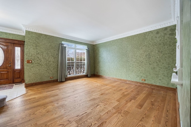 unfurnished living room featuring light wood-type flooring and crown molding