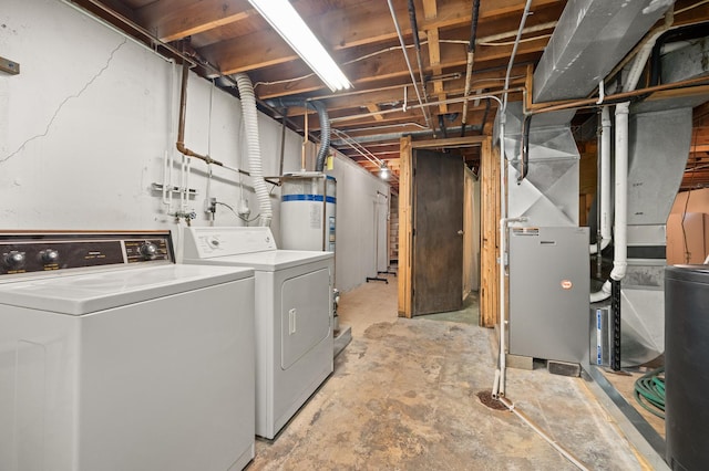 washroom featuring gas water heater and independent washer and dryer