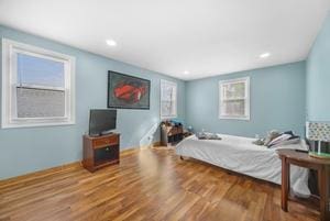 bedroom with hardwood / wood-style floors