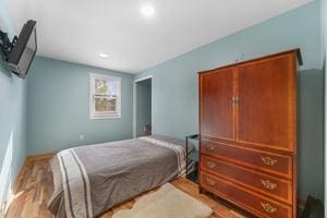 bedroom with light hardwood / wood-style flooring