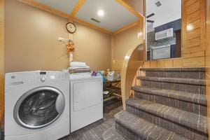 clothes washing area featuring washer and dryer