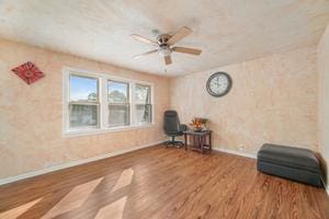 unfurnished room featuring ceiling fan and wood-type flooring