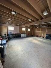 carpeted bedroom featuring beamed ceiling, ceiling fan, and wooden ceiling