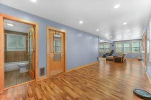 unfurnished living room featuring hardwood / wood-style floors