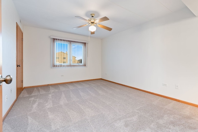 unfurnished room featuring light colored carpet and ceiling fan