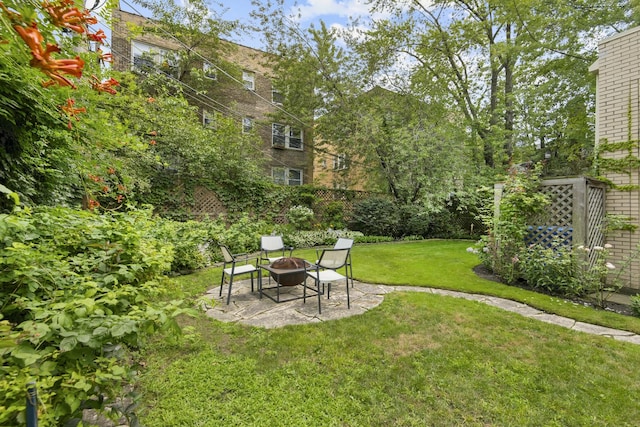 view of yard with a patio and a fire pit