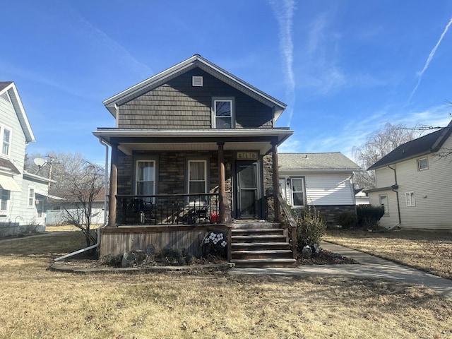 view of front of home featuring a porch and a front yard