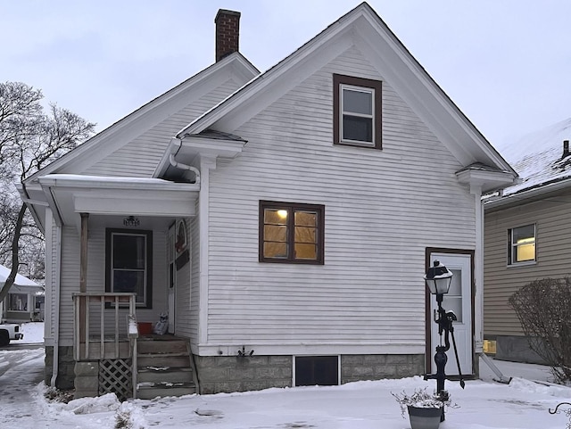 view of snow covered house