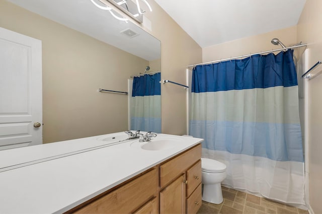 full bathroom with vanity, toilet, and shower / bath combo