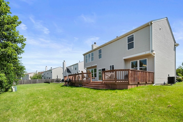 back of property featuring central AC, a yard, and a wooden deck