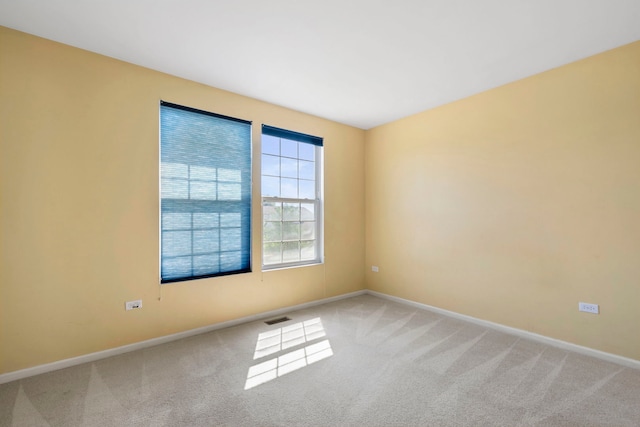 unfurnished room featuring carpet