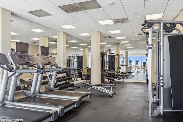 exercise room with a paneled ceiling