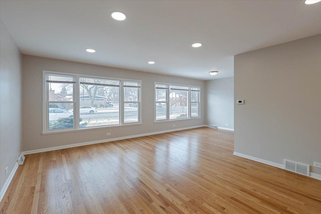 unfurnished room featuring light hardwood / wood-style flooring