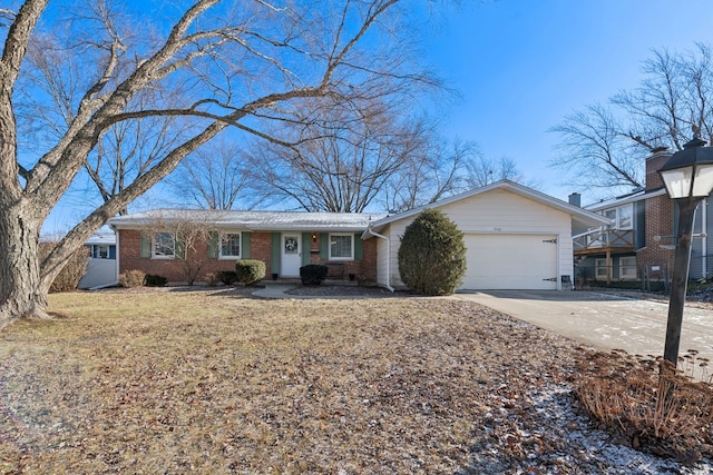 ranch-style house featuring a front lawn and a garage