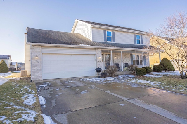 view of property featuring cooling unit, covered porch, and a garage