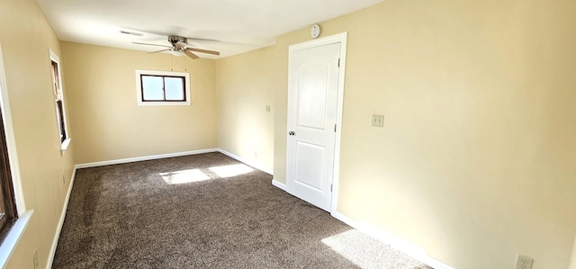 carpeted empty room with ceiling fan