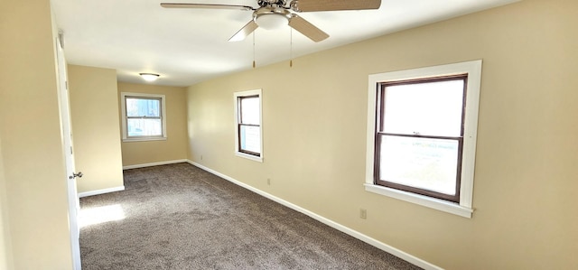 spare room with ceiling fan and carpet floors