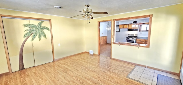 interior space featuring ceiling fan and light hardwood / wood-style floors