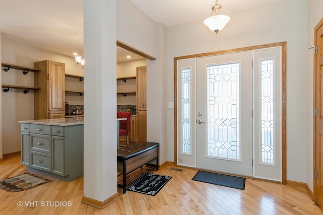 foyer entrance with light wood-type flooring