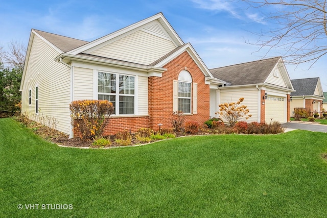 view of front of property with a front yard and a garage