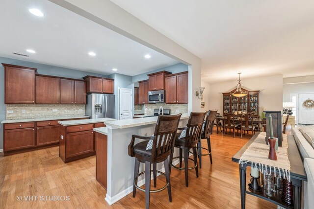 dining space featuring light hardwood / wood-style floors