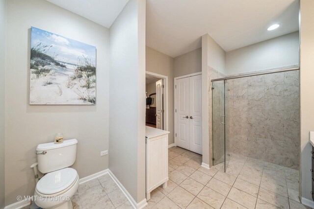 bathroom with vanity and a shower with door