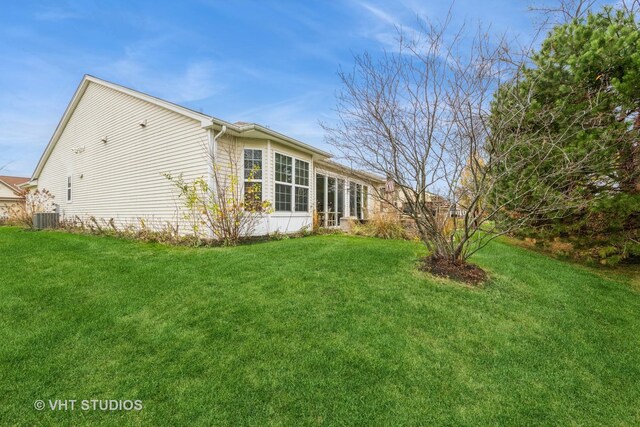 view of home's exterior with a yard