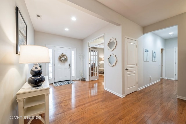 office area featuring ceiling fan, light hardwood / wood-style flooring, and french doors