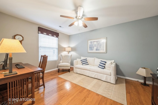 bedroom with ceiling fan and hardwood / wood-style floors