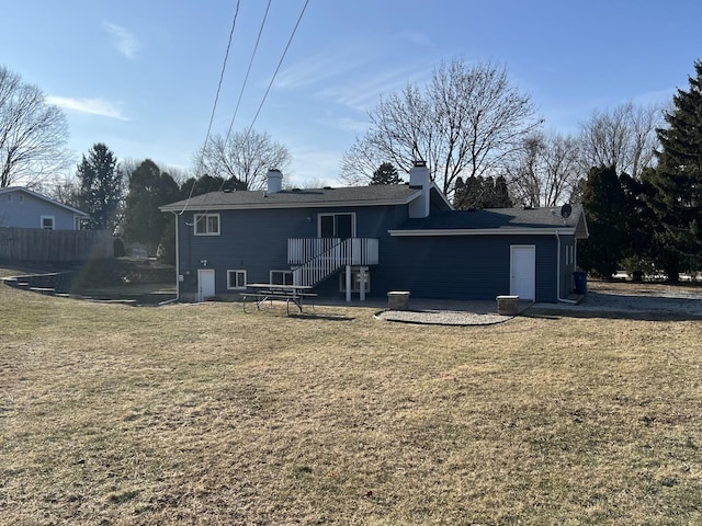 back of house with a yard