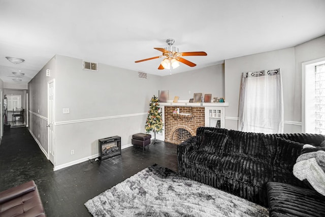 living room with ceiling fan, dark wood-type flooring, and a brick fireplace