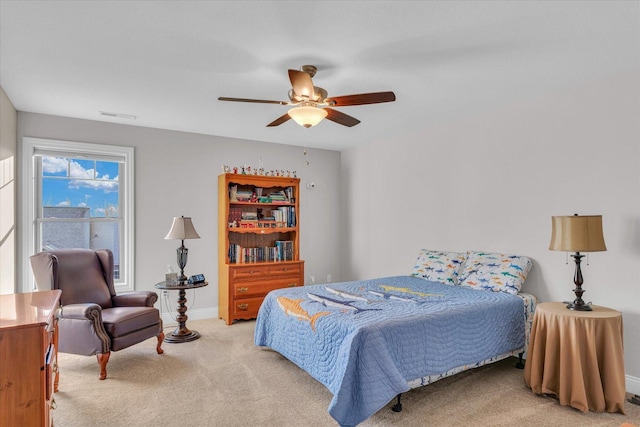 carpeted bedroom with ceiling fan