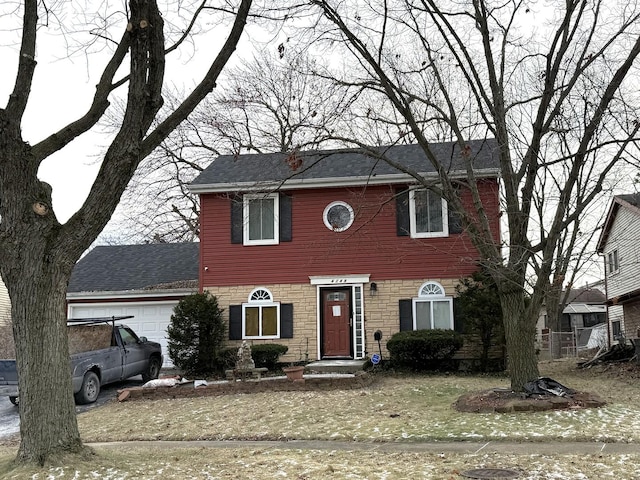 colonial house featuring a garage