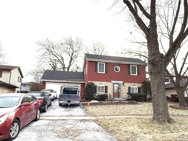 view of front of property with a garage