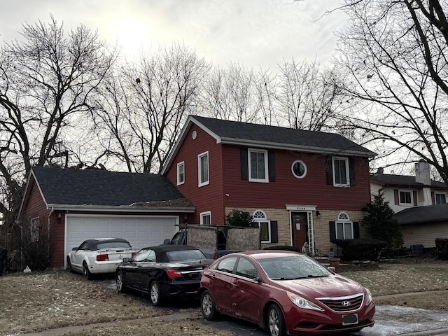 view of front of property with a garage