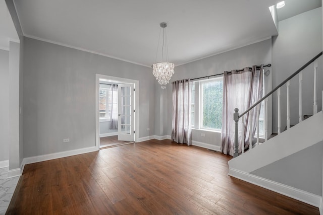 interior space with crown molding, hardwood / wood-style floors, and a chandelier