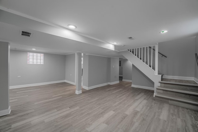 basement featuring light hardwood / wood-style floors