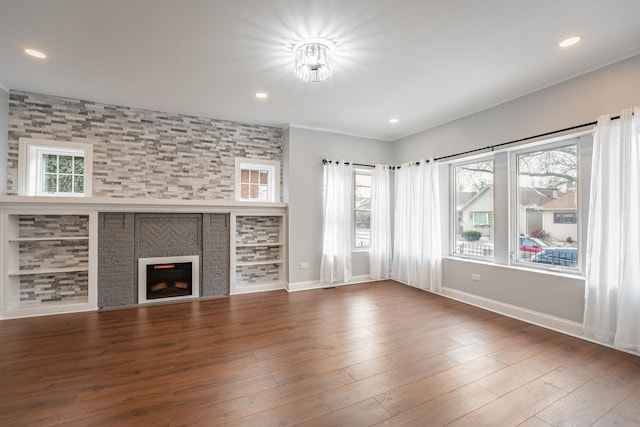 unfurnished living room featuring a fireplace and dark wood-type flooring